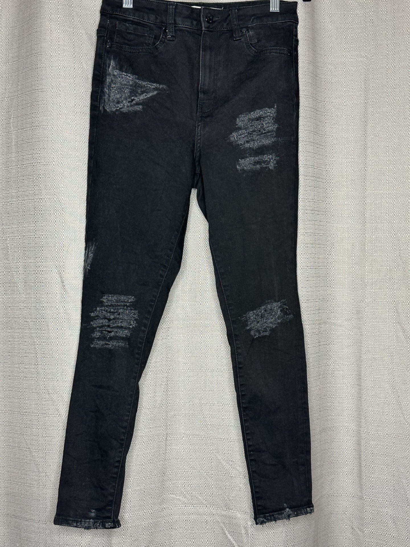 Black distressed skinny leg jeans