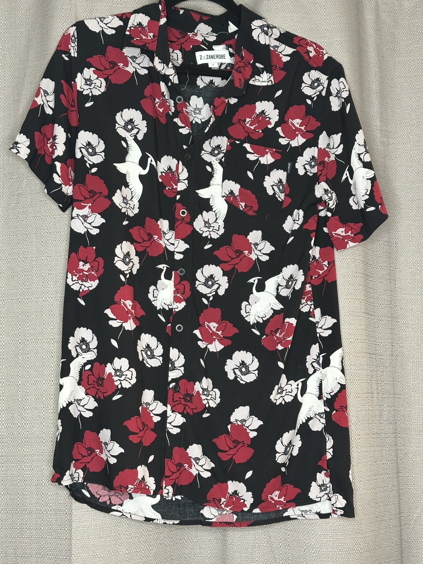 Black shirt with red and white floral pattern
