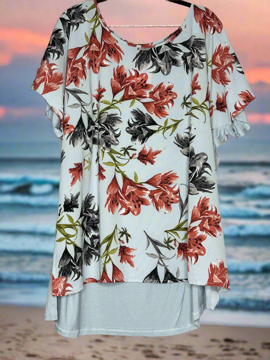 Floral blouse with red and black flowers on a pale blue/grey background. Soft Plain back