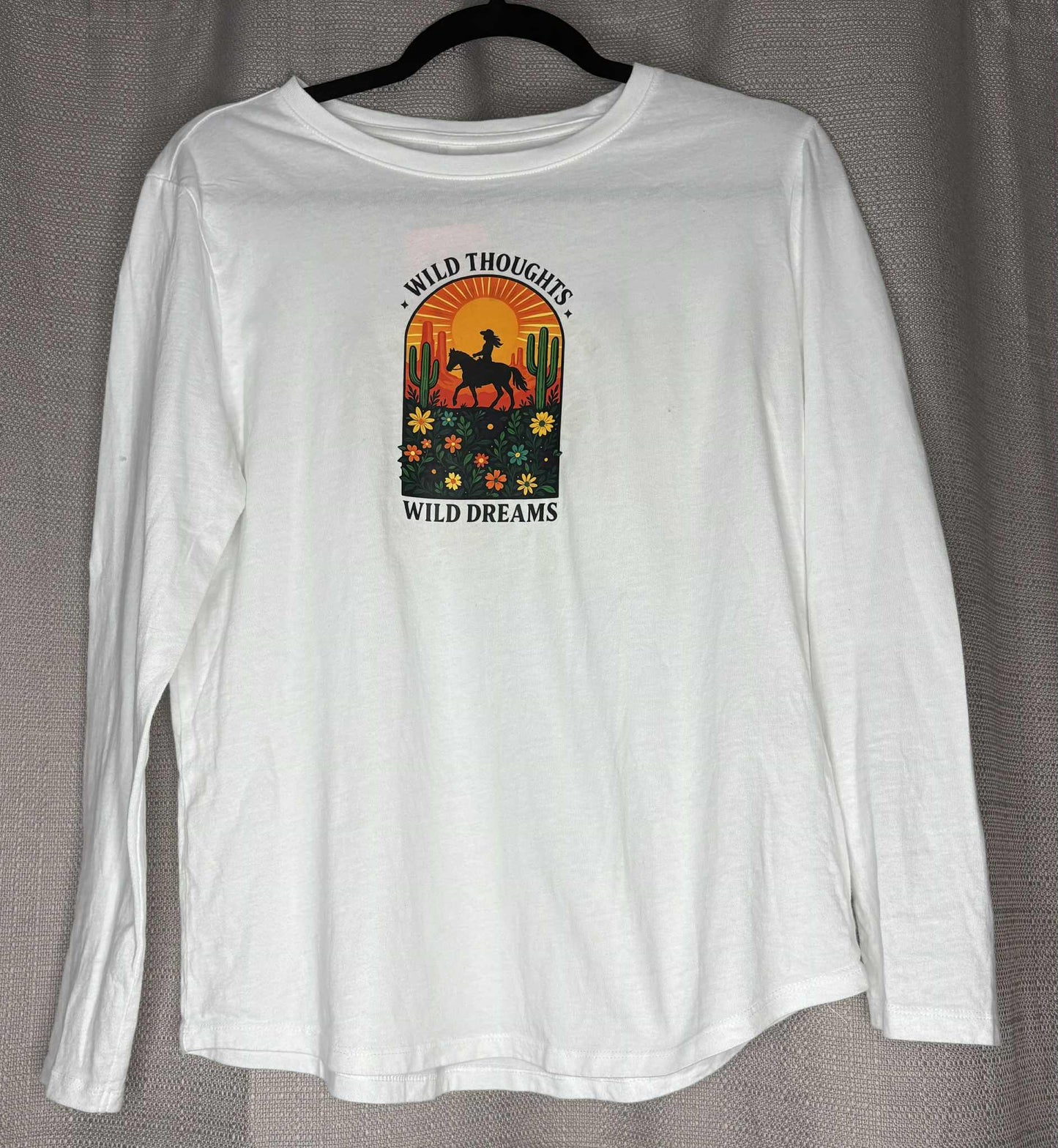 White long-sleeve shirt with a graphic design on a gray background