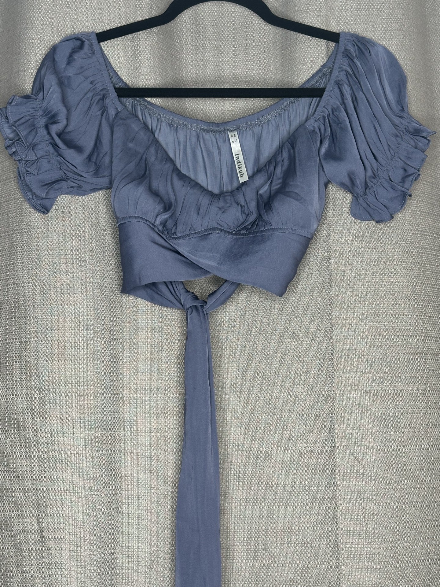 Blue off-shoulder top with ruffled sleeves & tie back