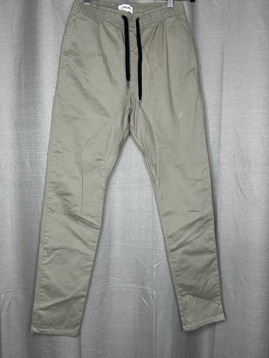 Beige pants with black drawstring waist 