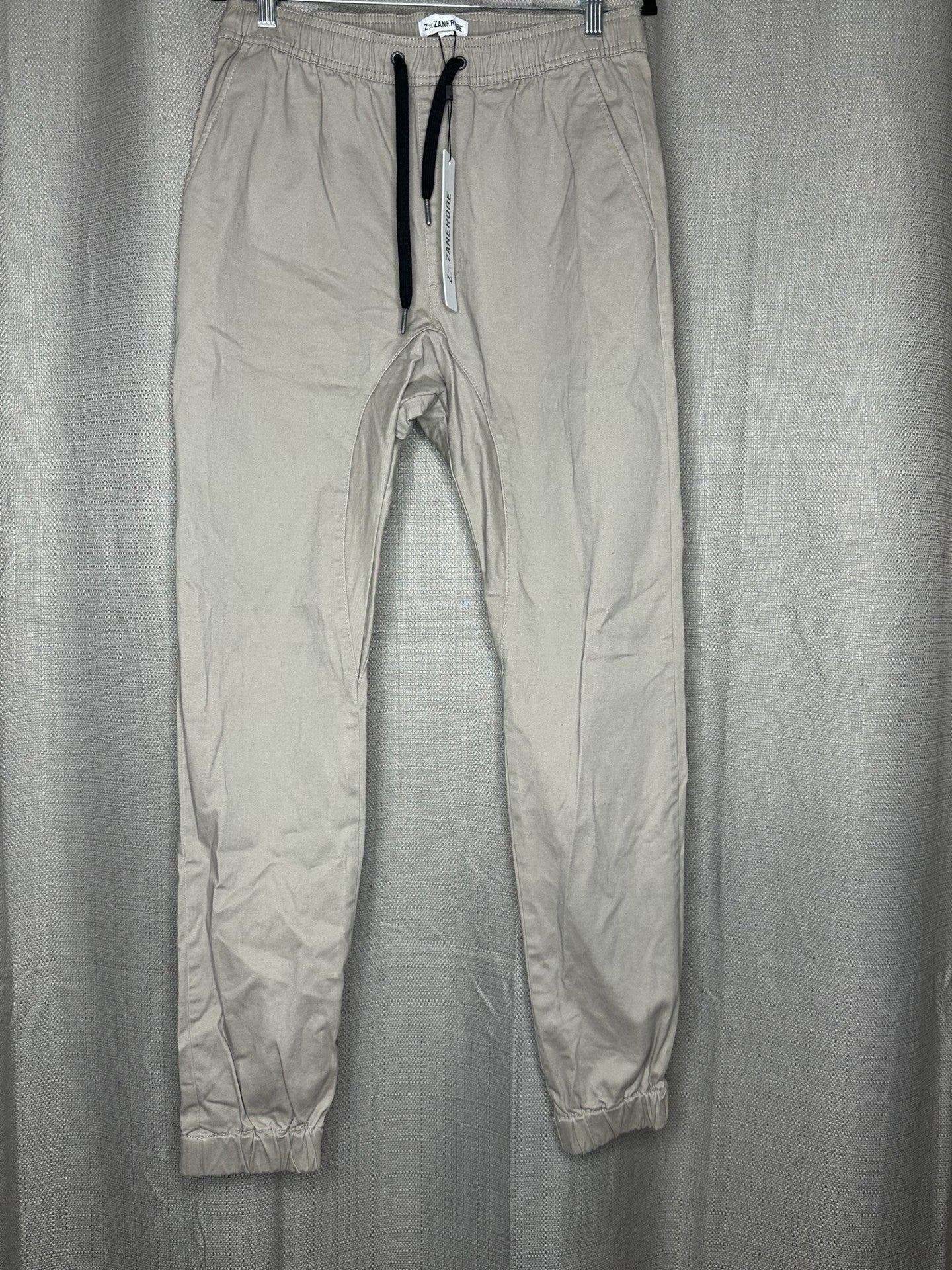 Beige pants with drawstring waist & elasticated cuffs