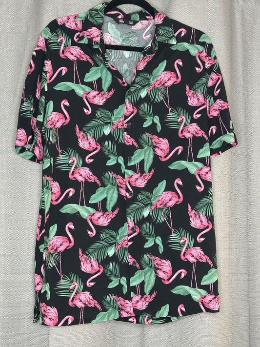 Black shirt with pink flamingo and green leaf pattern 
