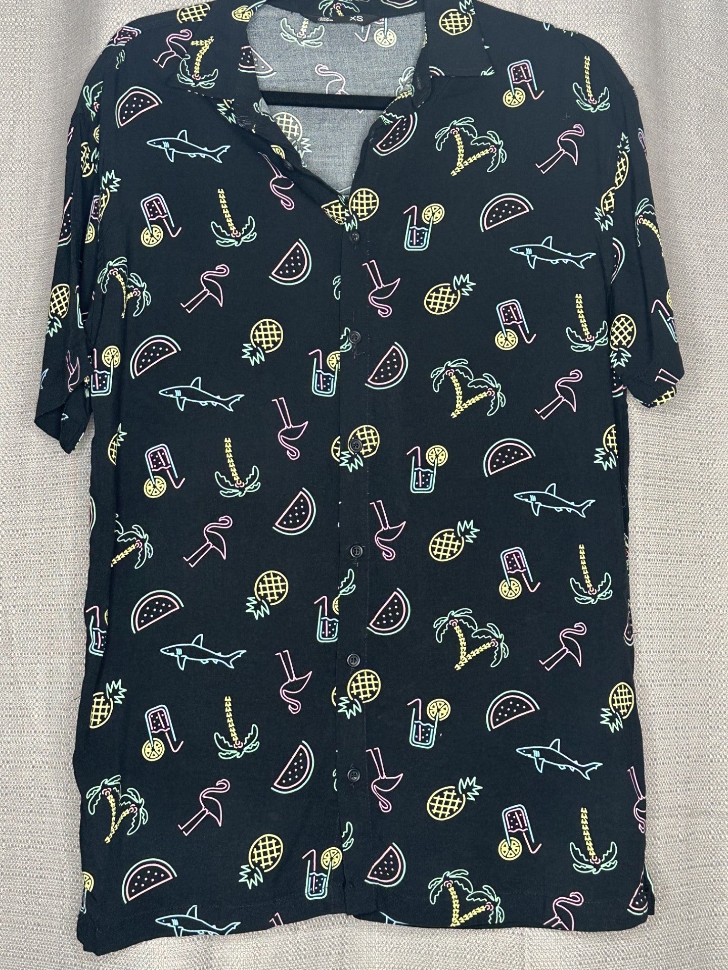 Black short sleeved shirt with colorful summer-themed pattern 