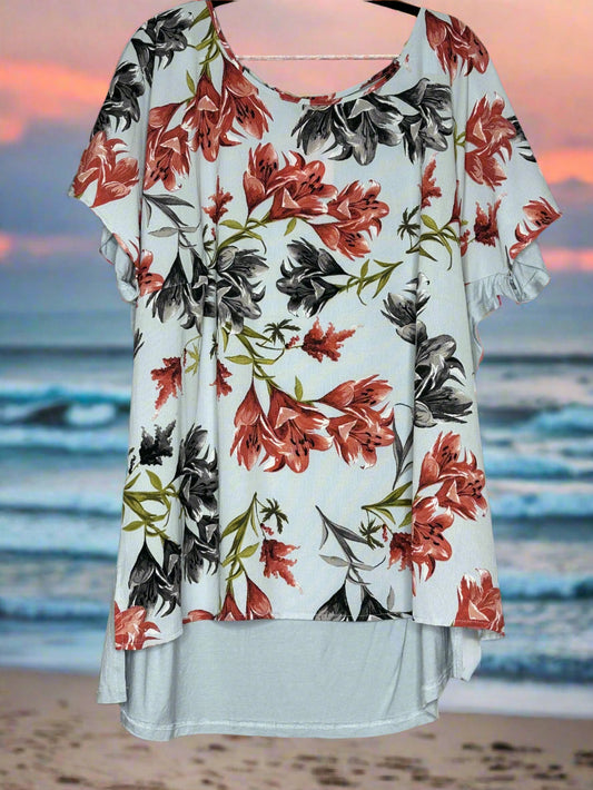 Floral blouse with red and black flowers on a pale blue/grey  background. Soft Plain back