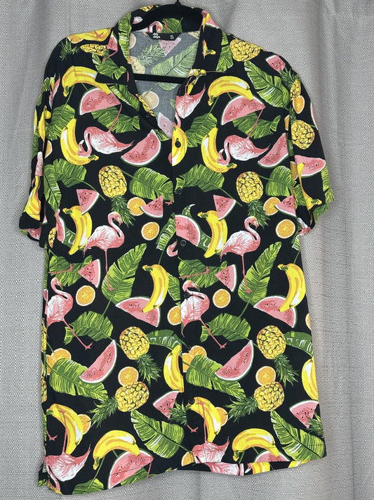 Fruit patterned shirt with bananas, watermelons, and pineapples on a black background