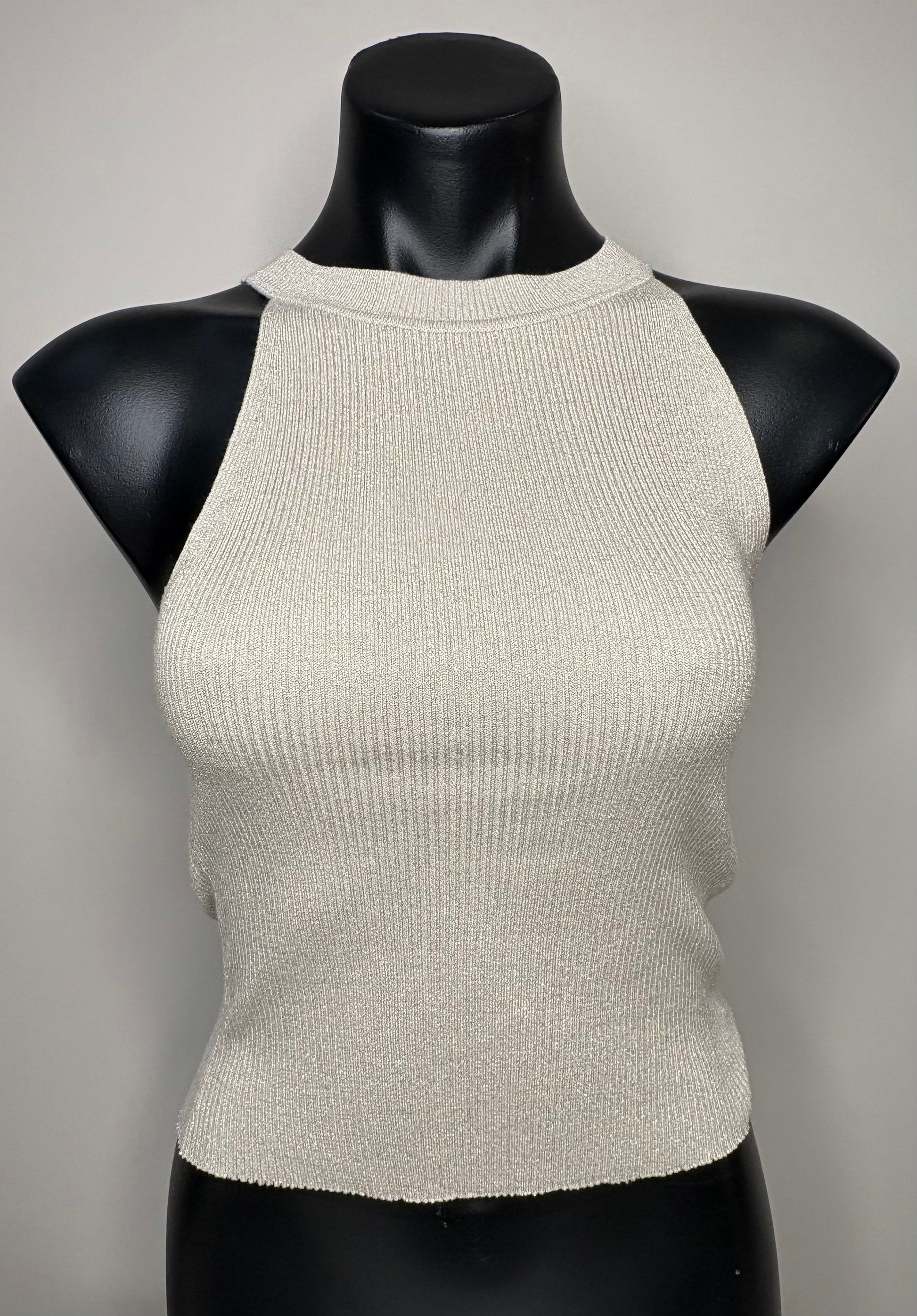 Beige ribbed knit top on a black mannequin against a gray background