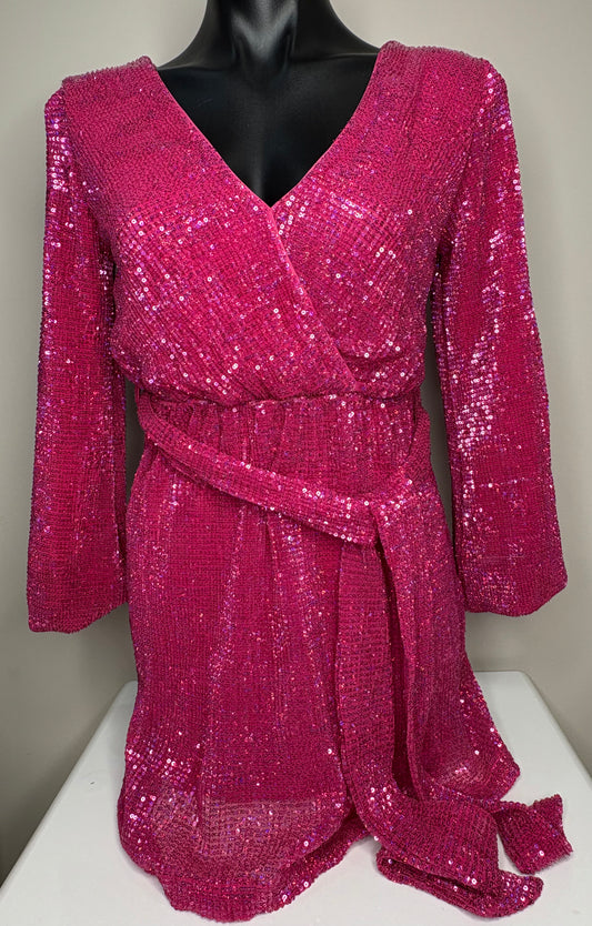Pink sequin dress on a mannequin against a neutral background