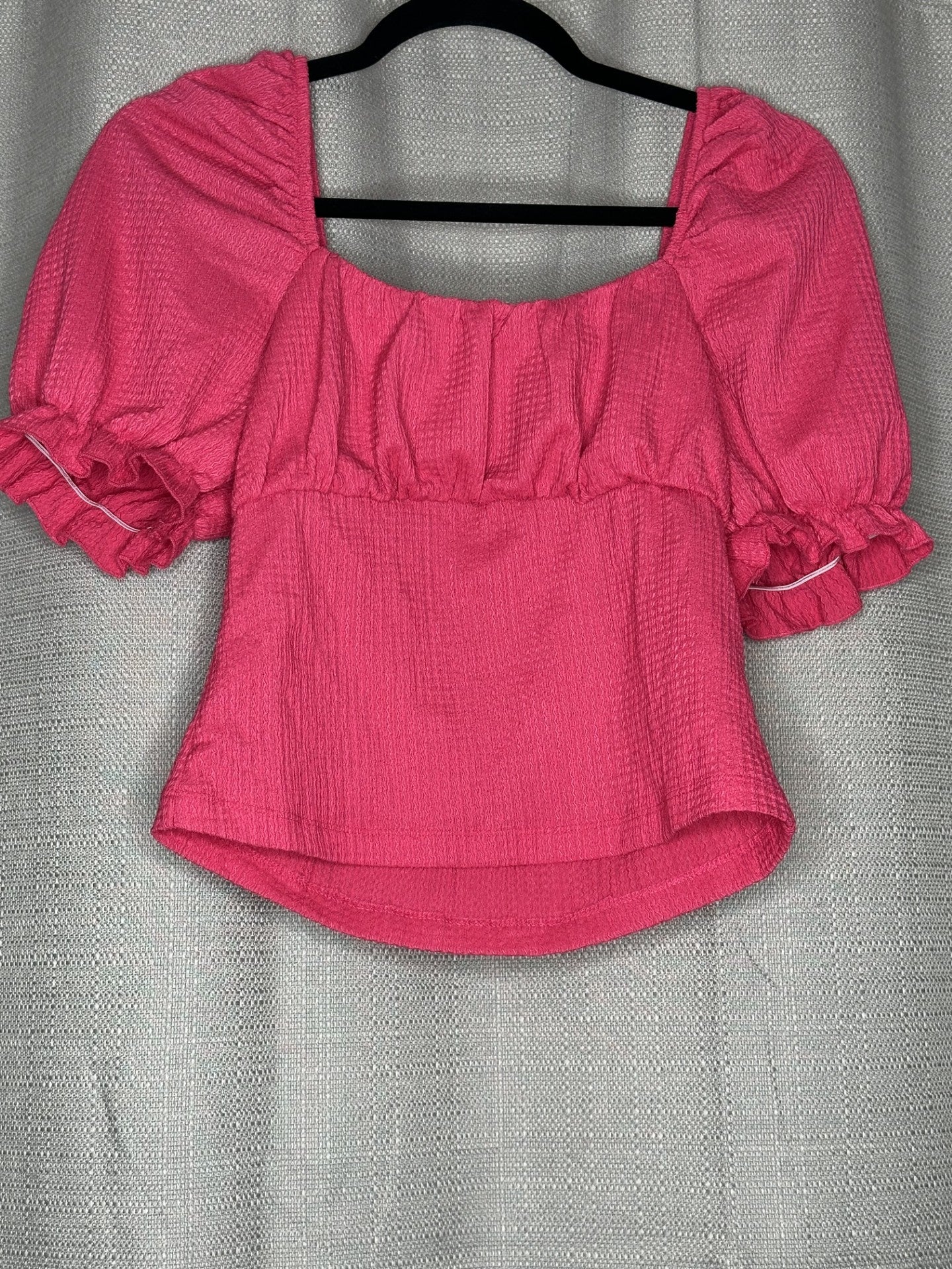 Pink blouse with ruffled sleeves