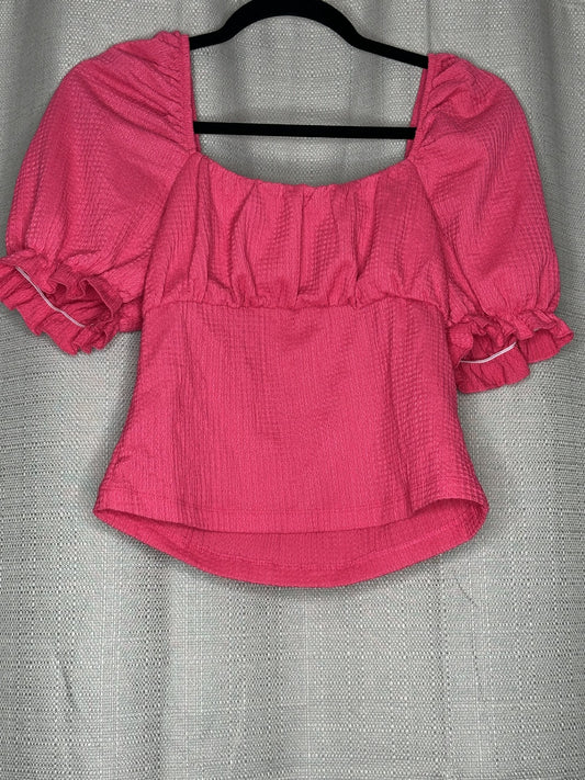 Pink blouse with ruffled sleeves