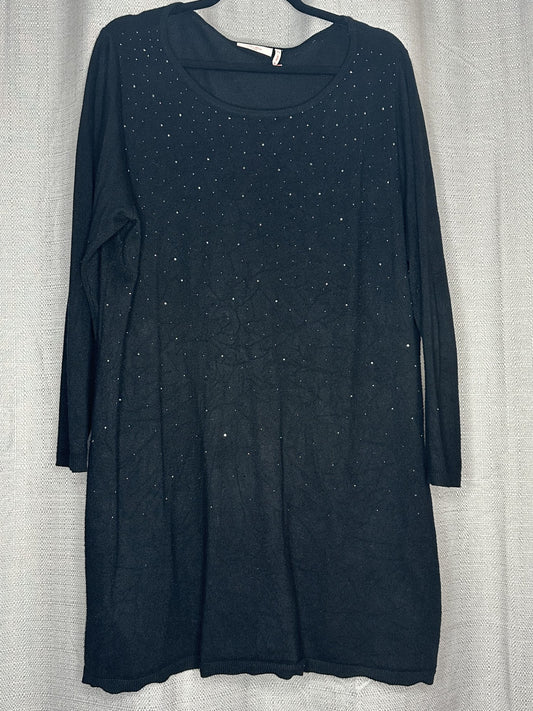 Black dress with small white embellishments on a light gray background