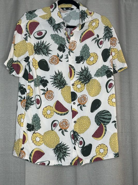 Hawaiian fruit pattern on an off white shirt