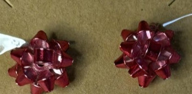 Pair of hot pink bow shaped earrings