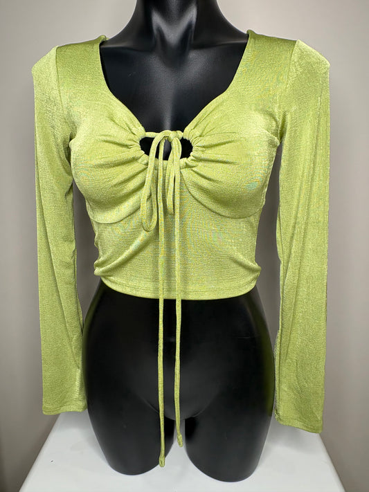 Green long-sleeve top with a bow detail on a mannequin against a neutral background