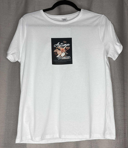 White t-shirt with a graphic design on a gray background