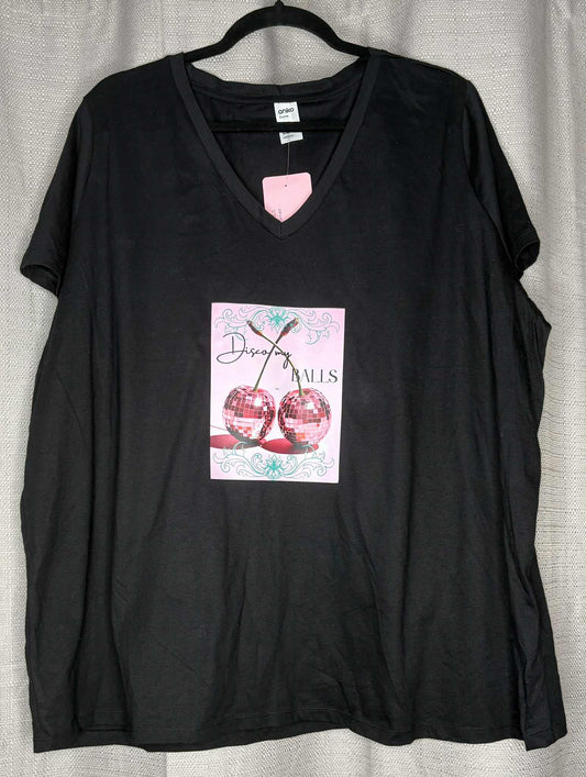 Black t-shirt with a graphic design on a hanger against a neutral background