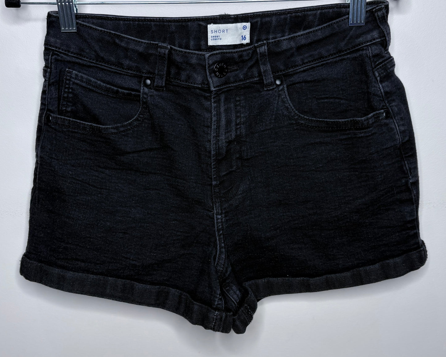 Black denim shorts on a white background