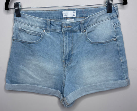 Blue denim shorts on a hanger against a gray background