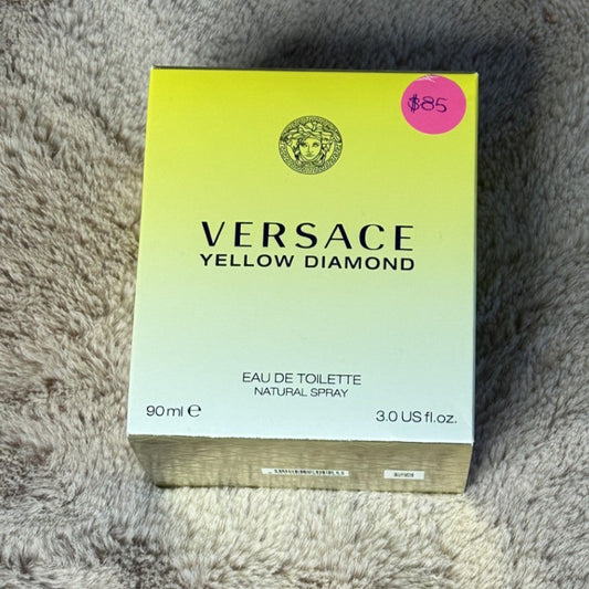 Versace Yellow Diamond perfume box on a textured surface