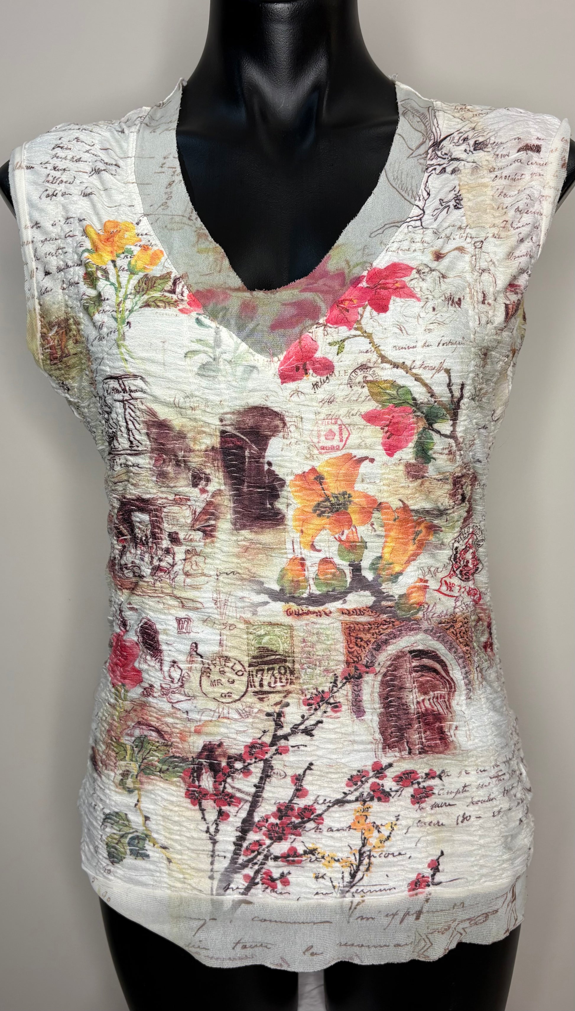 Sleeveless top with floral and architectural design on a mannequin against a neutral background