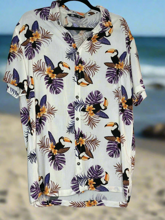 White shirt with toucan and leaf pattern on a white shirt