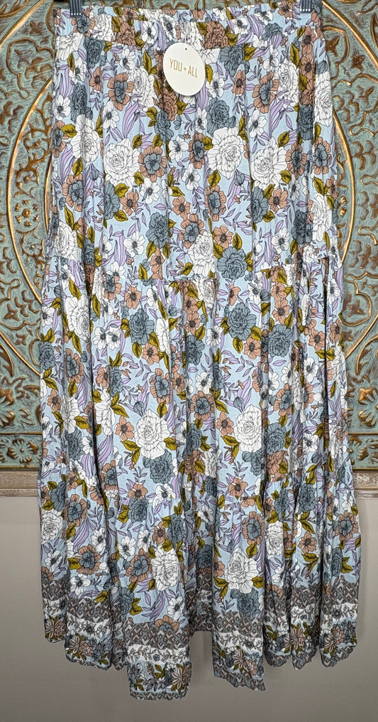 Floral patterned fabric draped over a decorative background